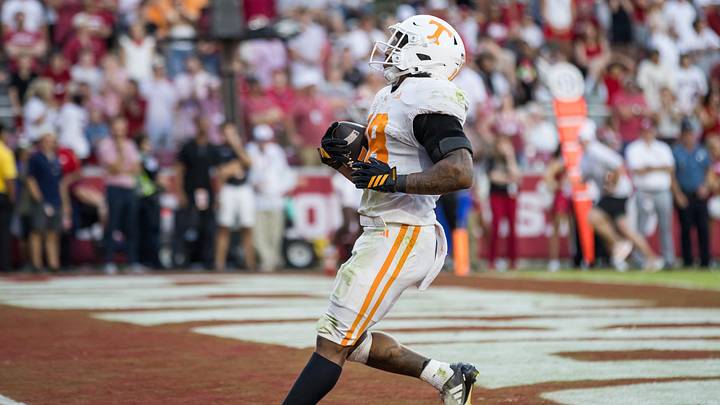 Oct 10, 2026; Fayetteville, Arkansas, USA; Tennessee Volunteers running back DeSean Bishop (18) scores a touchdown during the fourth quarter against the Arkansas Razorbacks at Donald W. Reynolds Razorback Stadium. Mandatory Credit: Brett Rojo-Imagn Images Oct 10, 2026; Fayetteville, Arkansas, USA; Tennessee Volunteers running back DeSean Bishop (18) scores a touchdown during the fourth quarter against the Arkansas Razorbacks at Donald W. Reynolds Razorback Stadium. Mandatory Credit: Brett Rojo-Imagn Images