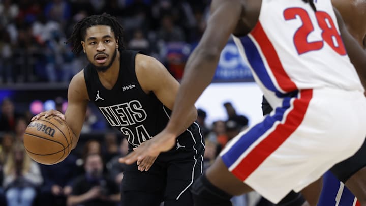 Feb 1, 2026; Detroit, Michigan, USA;  Brooklyn Nets guard Cam Thomas (24) dribbles defended by Detroit Pistons forward Isaiah Stewart (28) in the first half at Little Caesars Arena. Mandatory Credit: Rick Osentoski-Imagn Images