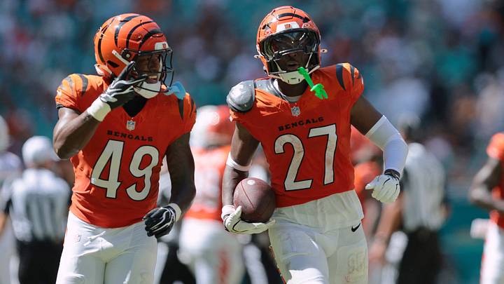 Oct 11, 2026; Miami Gardens, Florida, USA; Cincinnati Bengals linebacker Barrett Carter (49) and safety Jordan Battle (27) celebrate an interception against the Miami Dolphins during the second quarter at Hard Rock Stadium. Mandatory Credit: Sam Navarro-Imagn Images Oct 11, 2026; Miami Gardens, Florida, USA; Cincinnati Bengals linebacker Barrett Carter (49) and safety Jordan Battle (27) celebrate an interception against the Miami Dolphins during the second quarter at Hard Rock Stadium. Mandatory Credit: Sam Navarro-Imagn Images