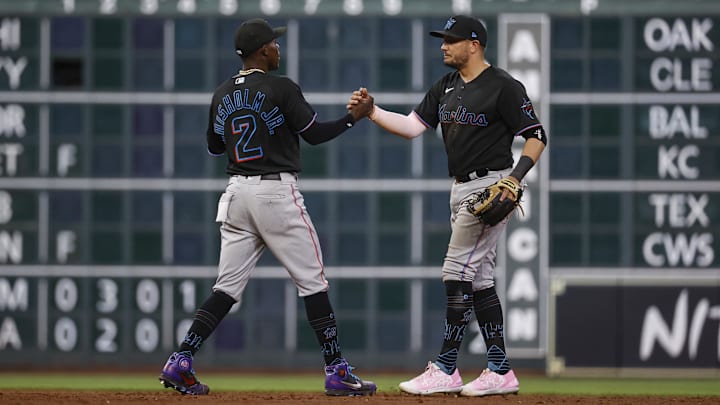 Jun 10, 2022; Houston, Texas, USA; Miami Marlins second baseman Jazz Chisholm Jr. (2) celebrates with shortstop Miguel Rojas (11) after the Marlins defeated the Houston Astros at Minute Maid Park. Mandatory Credit: Troy Taormina-Imagn Images Jun 10, 2022; Houston, Texas, USA; Miami Marlins second baseman Jazz Chisholm Jr. (2) celebrates with shortstop Miguel Rojas (11) after the Marlins defeated the Houston Astros at Minute Maid Park. Mandatory Credit: Troy Taormina-Imagn Images