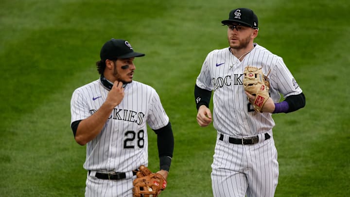 Aug 12, 2020; Denver, Colorado, USA; Colorado Rockies third baseman Nolan Arenado (28) talks with shortstop Trevor Story (27) as they walk to the dugout in the middle of the seventh inning against the Arizona Diamondbacks at Coors Field. Mandatory Credit: Isaiah J. Downing-Imagn Images