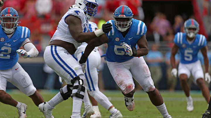 Sep 28, 2024; Oxford, Mississippi, USA; Mississippi Rebels defensive linemen Zxavian Harris (51) rushes as Kentucky Wildcats offensive lineman Jalen Farmer (52) blocks during the first half at Vaught-Hemingway Stadium. Mandatory Credit: Petre Thomas-Imagn Images