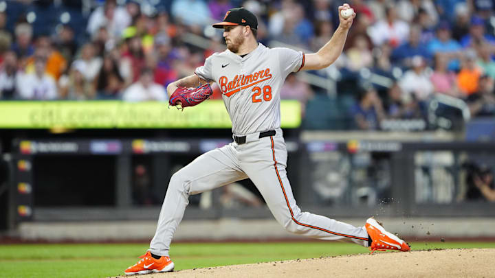Aug 19, 2024; New York City, New York, USA; Baltimore Orioles pitcher Trevor Rogers (28) delivers a pitch against the New York Mets during the first inning at Citi Field