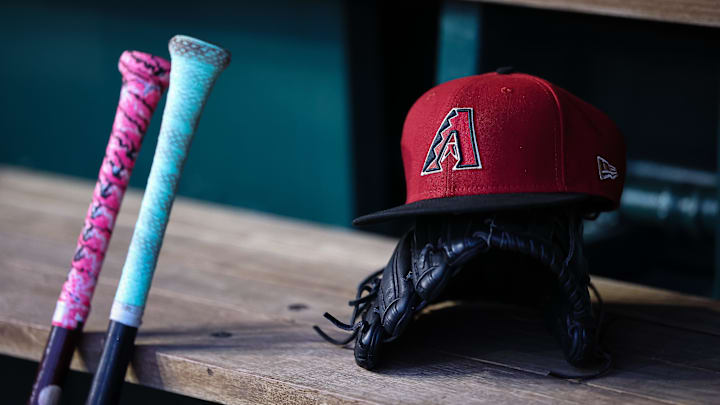 Jun 7, 2023; Washington, District of Columbia, USA; A general view of an Arizona Diamondbacks hat, glove, and bats in the dugout during the fifth inning of the game against the Washington Nationals at Nationals Park. Mandatory Credit: Scott Taetsch-Imagn Images Jun 7, 2023; Washington, District of Columbia, USA; A general view of an Arizona Diamondbacks hat, glove, and bats in the dugout during the fifth inning of the game against the Washington Nationals at Nationals Park. Mandatory Credit: Scott Taetsch-Imagn Images