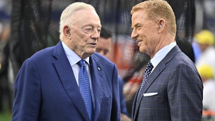 Dallas Cowboys owner Jerry Jones and NBC commentator Jason Garrett speak before the game against the Green Bay Packers.