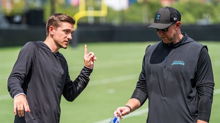 Jacksonville Jaguars general manager James Gladstone, left, talks with Jacksonville Jaguars head coach Liam Coen, right, after the. Jacksonville Jaguars’ mandatory minicamp Tuesday June 10, 2025 at the Miller Electric Center in Jacksonville, Fla. [Doug Engle/Florida Times-Union]