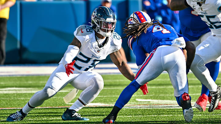 Oct 20, 2024; Orchard Park, New York, USA; Tennessee Titans safety Quandre Diggs (28) looks to make a tackle on Buffalo Bills running back James Cook (4) in the fourth quarter at Highmark Stadium. Mandatory Credit: Mark Konezny-Imagn Images