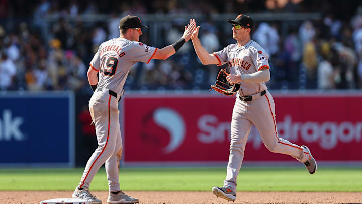 Sep 8, 2024; San Diego, California, USA; San Francisco Giants shortstop Tyler Fitzgerald (49) and San Francisco Giants right fielder Mike Yastrzemski (5) celebrate after defeating the San Diego Padres at Petco Park. Sep 8, 2024; San Diego, California, USA; San Francisco Giants shortstop Tyler Fitzgerald (49) and San Francisco Giants right fielder Mike Yastrzemski (5) celebrate after defeating the San Diego Padres at Petco Park.