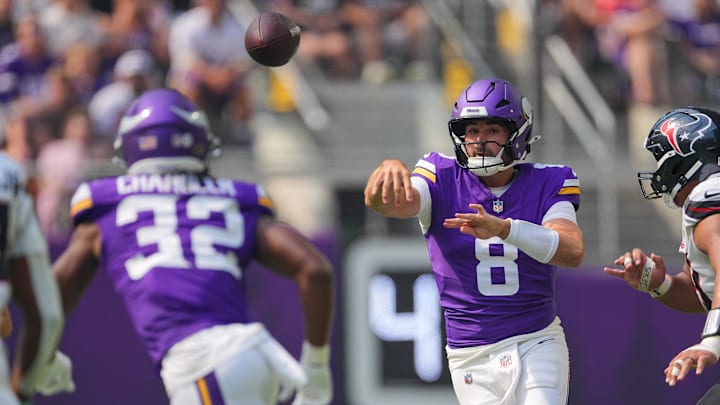 Aug 9, 2025; Minneapolis, Minnesota, USA; Minnesota Vikings quarterback Sam Howell (8) passes to running back Ty Chandler (32) against the Houston Texans in the first quarter at U.S. Bank Stadium. Mandatory Credit: Brad Rempel-Imagn Images