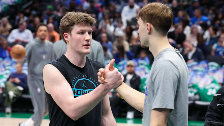 Jan 29, 2026; Dallas, Texas, USA; Dallas Mavericks forward Cooper Flagg (right) speaks with Charlotte Hornets guard Kon Knueppel (left) before the game at American Airlines Center. Mandatory Credit: Kevin Jairaj-Imagn Images