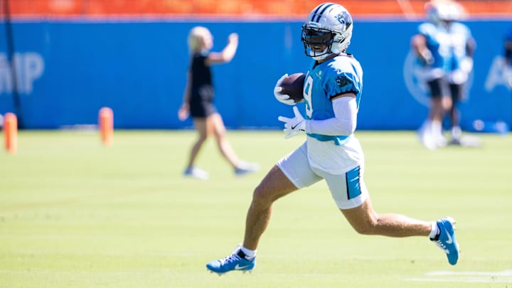 Carolina Panthers wide receiver Adam Thielen runs after a catch during practice at training camp.