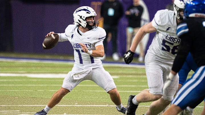 Iowa City Liberty's Reece Rettig looks to attempt a pass during the semifinal round of the Iowa high school football state championships at the UNI-Dome on Friday, Nov. 14, 2025, in Cedar Falls.