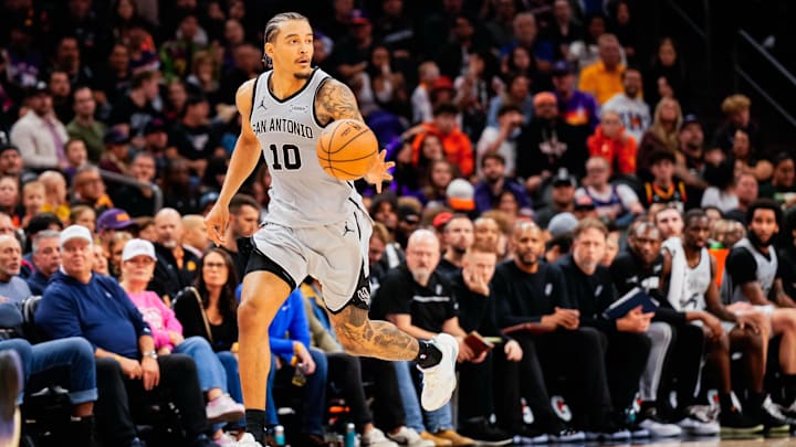 Nov 23, 2025; Phoenix, Arizona, USA; San Antonio Spurs forward Jeremy Sochan (10) dribbles in the second half of the game at Mortgage Match Up Center. Mandatory Credit: Arianna Grainey-Imagn Images