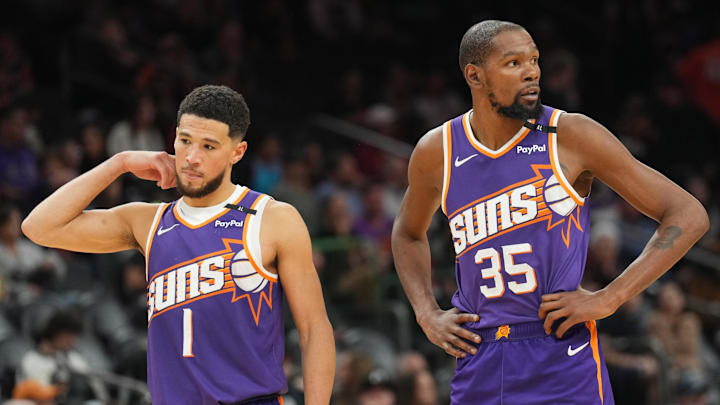 Nov 27, 2024; Phoenix, Arizona, USA; Phoenix Suns guard Devin Booker (1) and Phoenix Suns forward Kevin Durant (35) look on against the Brooklyn Nets during the second half at Footprint Center. Mandatory Credit: Joe Camporeale-Imagn Images Nov 27, 2024; Phoenix, Arizona, USA; Phoenix Suns guard Devin Booker (1) and Phoenix Suns forward Kevin Durant (35) look on against the Brooklyn Nets during the second half at Footprint Center. Mandatory Credit: Joe Camporeale-Imagn Images