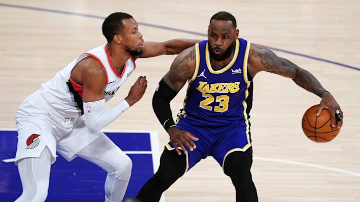 Los Angeles Lakers forward LeBron James (23) is defended by Portland Trail Blazers guard Rodney Hood (5) in the first half at Staples Center. Mandatory Credit: Kirby Lee-Imagn Images