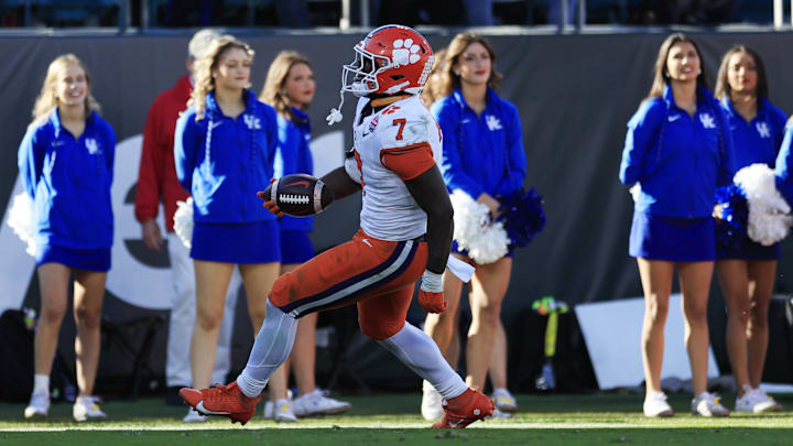 Clemson Tigers running back Phil Mafah scores a touchdown in the TaxSlayer Gator Bowl against the Kentucky Wildcats. 