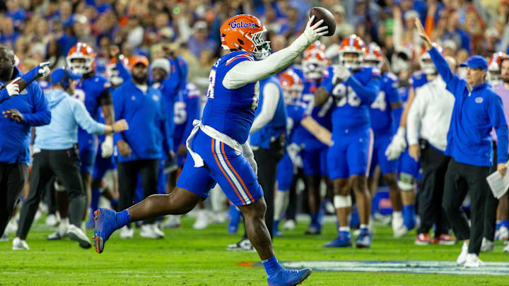 Nov 29, 2025; Gainesville, Florida, USA; Florida Gators defensive tackle Caleb Banks (88) celebrates recovering a fumble during the second quarter against the Florida State Seminoles at Ben Hill Griffin Stadium. Mandatory Credit: Bob Kupbens-Imagn Images