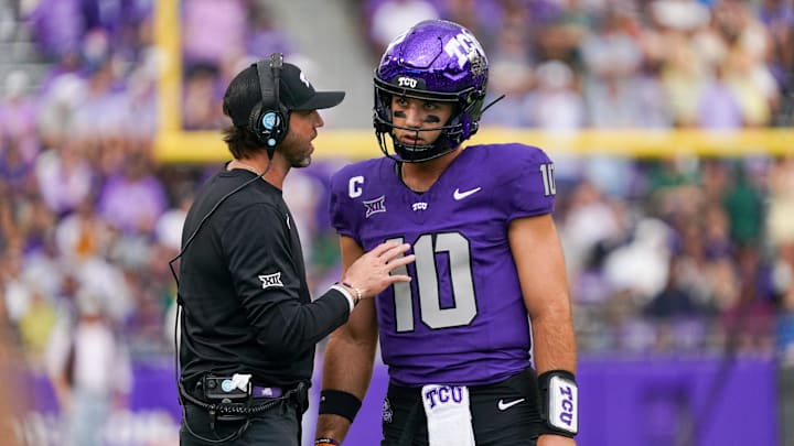 Oct 18, 2025; Fort Worth, Texas, USA; TCU Horned Frogs quarterback Josh Hoover (10) talks with associate head coach Kendal Briles during the first half of a game against the Baylor Bears at Amon G. Carter Stadium. Mandatory Credit: Raymond Carlin III-Imagn Images