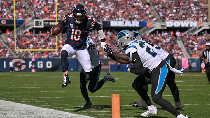 Oct 6, 2024; Chicago, Illinois, USA; Chicago Bears quarterback Caleb Williams (18) runs the ball against the Carolina Panthers during the third quarter at Soldier Field. Mandatory Credit: Daniel Bartel-Imagn Images