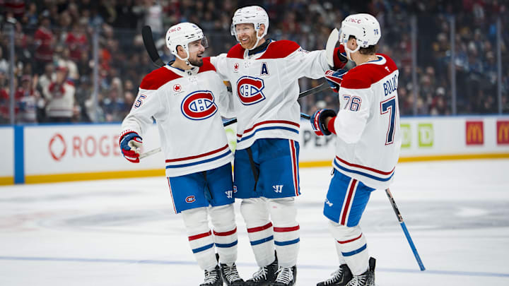 Oct 25, 2025; Vancouver, British Columbia, CAN; Montreal Canadiens defenseman Alexandre Carrier (45) and defenseman Mike Matheson (8) and forward Zachary Bolduc (76) celebrate Matheson’s goal against the Vancouver Canucks in the third period at Rogers Arena. Mandatory Credit: Bob Frid-Imagn Images
