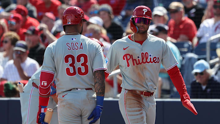 Feb 25, 2025; Port Charlotte, Florida, USA; Philadelphia Phillies outfielder Justin Crawford (80) celebrates with shortstop Edmundo Sosa (33) after scoring a run against the Tampa Bay Rays at Charlotte Sports Park. Feb 25, 2025; Port Charlotte, Florida, USA; Philadelphia Phillies outfielder Justin Crawford (80) celebrates with shortstop Edmundo Sosa (33) after scoring a run against the Tampa Bay Rays at Charlotte Sports Park.