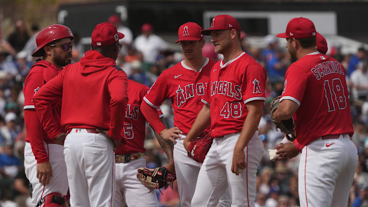 Mar 5, 2025; Tempe, Arizona, USA; Los Angeles Angels manager Ron Washington talks to pitcher Reid Detmers (48) in the third inning at Tempe Diablo Stadium. Mandatory Credit: Rick Scuteri-Imagn Images