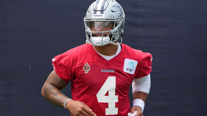 Dallas Cowboys quarterback Dak Prescott enters the field during training camp at the River Ridge Fields. 