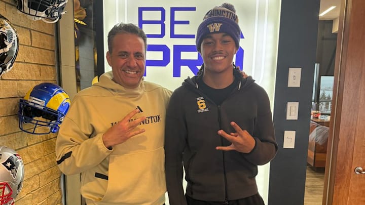 Jedd Fisch and Malakai Taufoou share a recruiting moment. 