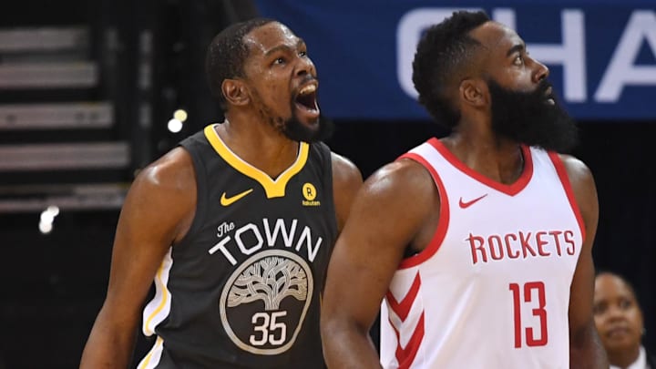 May 22, 2018; Oakland, CA, USA; Golden State Warriors forward Kevin Durant (35) reacts beside Houston Rockets guard James Harden (13)  during the first quarter in game four of the Western conference finals of the 2018 NBA Playoffs at Oracle Arena. Mandatory Credit: Kyle Terada-Imagn Images