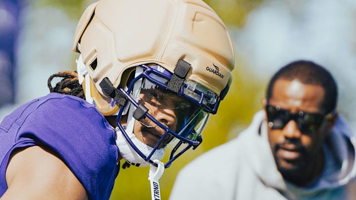 Omari Evans waits for his turn as receivers coach Kevin Cummings looks on in spring ball. Omari Evans waits for his turn as receivers coach Kevin Cummings looks on in spring ball.