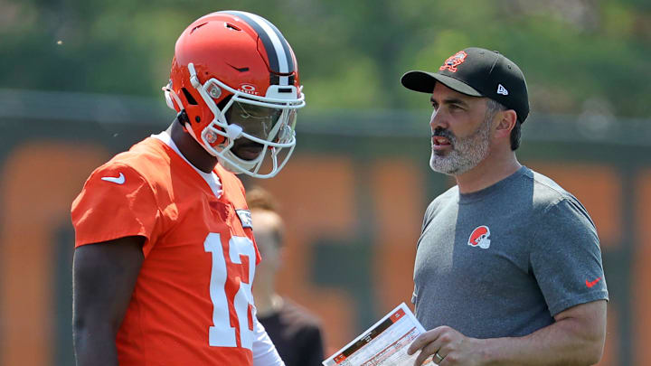 Cleveland Browns quarterback Shedeur Sanders (12) speaks with head coach Kevin Stefanski during practice at NFL minicamp, Wednesday, June 11, 2025, in Berea, Ohio.