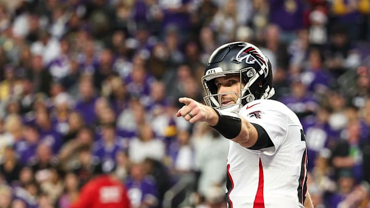 Dec 8, 2024; Minneapolis, Minnesota, USA; Atlanta Falcons quarterback Kirk Cousins (18) celebrates running back Bijan Robinson's (7) touchdown against the Minnesota Vikings during the third quarter at U.S. Bank Stadium. Mandatory Credit: Matt Krohn-Imagn Images