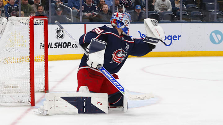 Mar 3, 2026; Columbus, Ohio, USA; Columbus Blue Jackets goalie Elvis Merzlikins (90) makes a glove save against the Nashville Predators during the first period at Nationwide Arena. Mandatory Credit: Russell LaBounty-Imagn Images