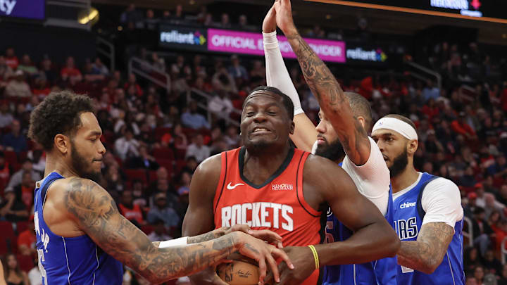 Rockets center Clint Capela fights for a rebound during game against the Dallas Mavericks. 