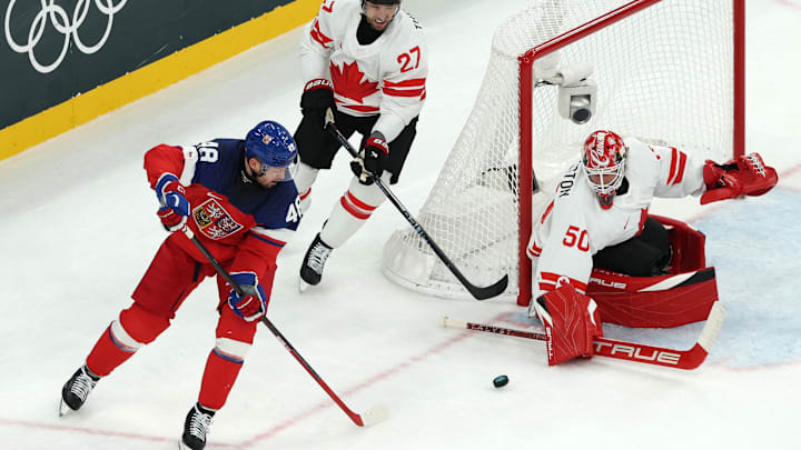 [US, Mexico & Canada customers only] Feb 12, 2026; Milan, Italy; Tomas Hertl of Czech Republic in action with Jordan Binnington and Shea Theodore of Canada  in a men's ice hockey Group A match during the Milano Cortina 2026 Olympic Winter Games at Milano Santagiulia Ice Hockey Arena. Mandatory Credit: Mike Segar/Reuters via Imagn Images
