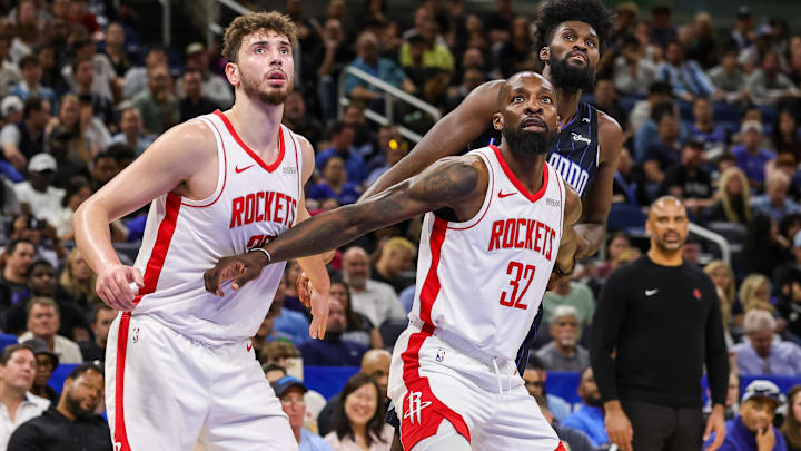 Houston Rockets center Alperen Sengun (28), forward Jeff Green (32) and Orlando Magic forward Jonathan Isaac (1) look for the rebound during the second quarter at Kia Center.