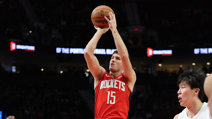 Jan 7, 2026; Portland, Oregon, USA;  Houston Rockets guard Reed Sheppard (15) shoots the ball against the Portland Trail Blazers during the first half at Moda Center. Mandatory Credit: Jaime Valdez-Imagn Images