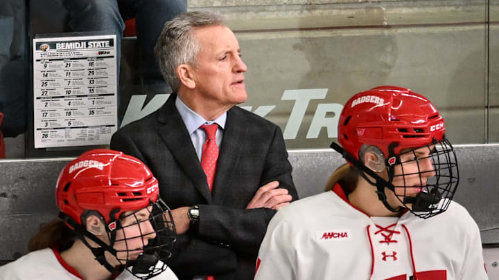 Wisconsin Badgers head coach Mark Johnson and players watch the action in the second period of a WCHA first-round game against the Bemidji State Beavers on Saturday, March 1, 2025, at LaBahn Arena in Madison, Wisconsin.
