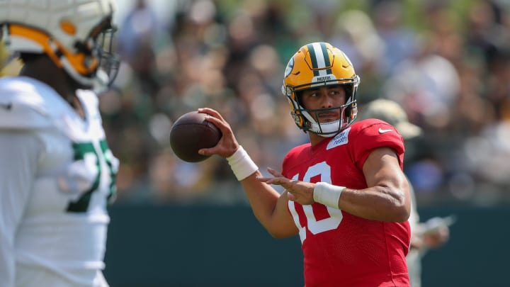 Armed with a contract extension, Green Bay Packers quarterback Jordan Love throws the ball at training camp on Saturday. Armed with a contract extension, Green Bay Packers quarterback Jordan Love throws the ball at training camp on Saturday.