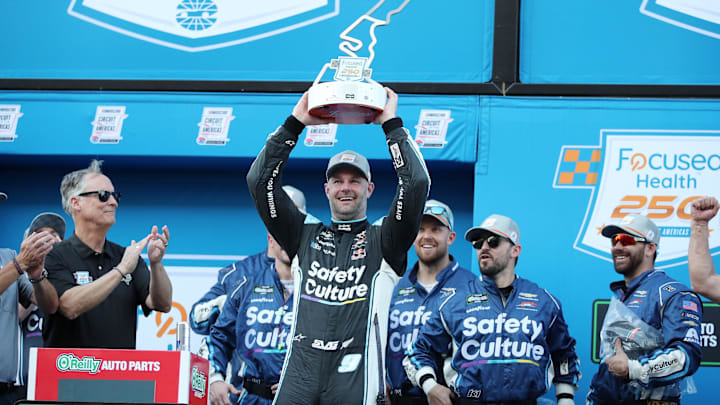 Feb 28, 2026; Austin, Texas, USA;  O’Reilly NASCAR O’Reilly Auto Parts Series driver Shane Van Gisbergen (9) with the trophy after winning the NASCAR O’Reilly Auto Parts Series Focused Health 250 at Circuit of the Americas. Mandatory Credit: Michael C. Johnson-Imagn Images