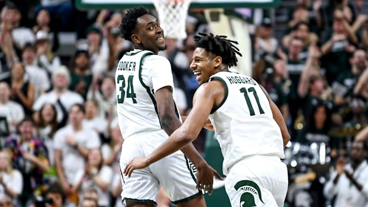 Michigan State's Xavier Booker, left, celebrates with A.J. Hoggard after Booker's 3-pointer against