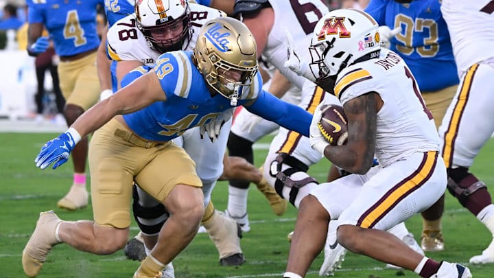 UCLA Bruins linebacker Carson Schwesinger moves to tackle Minnesota Golden Gophers running back Darius Taylor.