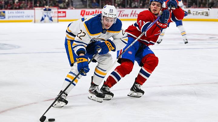 Nov 22, 2022; Montreal, Quebec, CAN; Buffalo Sabres right wing Jack Quinn (22) plays the puck against Montreal Canadiens center Jake Evans (71) during the second period at Bell Centre. Mandatory Credit: David Kirouac-USA TODAY Sports Nov 22, 2022; Montreal, Quebec, CAN; Buffalo Sabres right wing Jack Quinn (22) plays the puck against Montreal Canadiens center Jake Evans (71) during the second period at Bell Centre. Mandatory Credit: David Kirouac-USA TODAY Sports