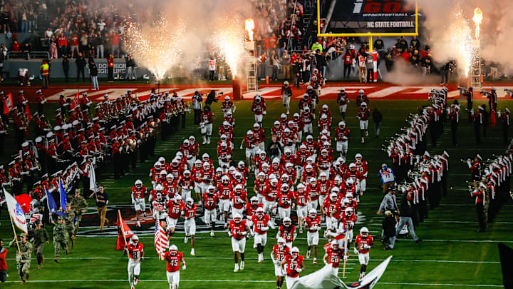 Nov 21, 2025; Raleigh, North Carolina, USA;  NC State Wolfpack takes to the field prior to the first half of the game against Florida State Seminoles at Carter-Finley Stadium. Mandatory Credit: Jaylynn Nash-Imagn Images
