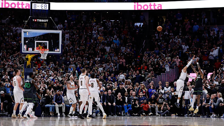 Apr 1, 2025; Denver, Colorado, USA; Minnesota Timberwolves guard Nickeil Alexander-Walker (9) is fouled by Denver Nuggets guard Russell Westbrook (4) as time expires in double overtime at Ball Arena.