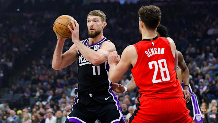 Jan 16, 2025; Sacramento, California, USA; Sacramento Kings forward Domantas Sabonis (11) controls the ball against Houston Rockets center Alperen Sengun (28) during the first quarter at Golden 1 Center. Mandatory Credit: Sergio Estrada-Imagn Images