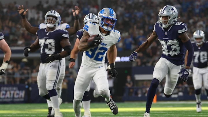 Oct 13, 2024; Arlington, Texas, USA; Detroit Lions safety Brian Branch (32) returns an interception during the second half against the Dallas Cowboys  at AT&T Stadium. Mandatory Credit: Kevin Jairaj-Imagn Images