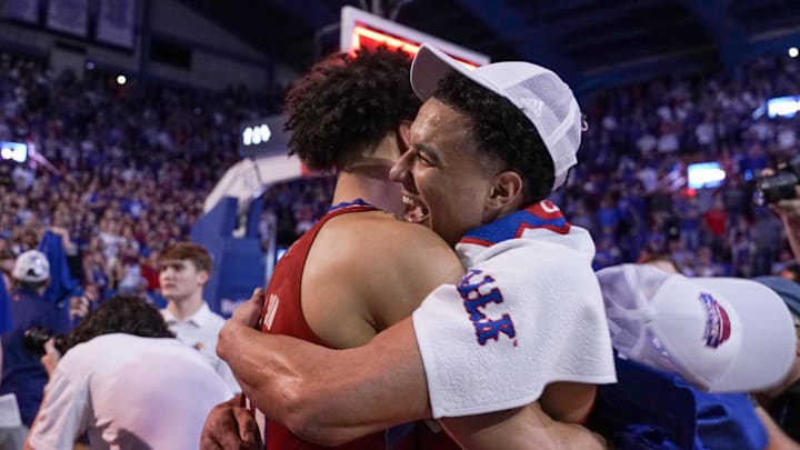 Feb 28, 2023; Lawrence, Kansas, USA; Kansas Jayhawks forward Jalen Wilson (10) and guard Kevin McCullar Jr. (15) embrace after the win over the Texas Tech Red Raiders at Allen Fieldhouse. Mandatory Credit: Denny Medley-Imagn Images