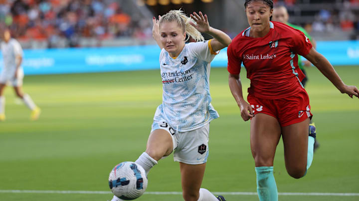 Oct 16, 2022; Houston, Texas, USA; Houston Dash midfielder Natalie Jacobs (30) and Kansas City