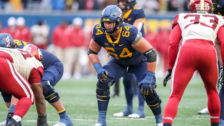 Nov 12, 2022; Morgantown, West Virginia, USA; West Virginia Mountaineers offensive lineman Wyatt Milum (64) during the third quarter against the Oklahoma Sooners at Mountaineer Field at Milan Puskar Stadium. Mandatory Credit: Ben Queen-Imagn Images